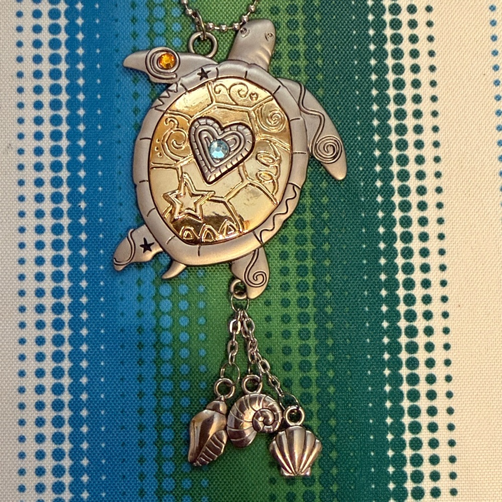 Turtle with charms in Silver and Gold Tones